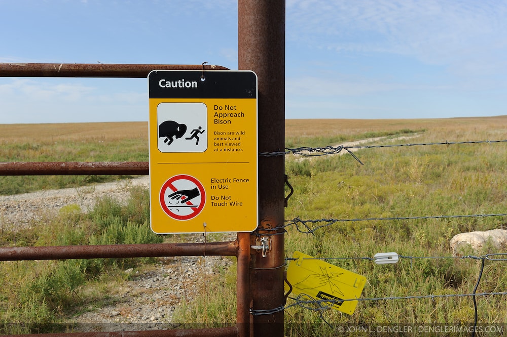 Bison and electric fence warning sign, Tallgrass Prairie National Preserve