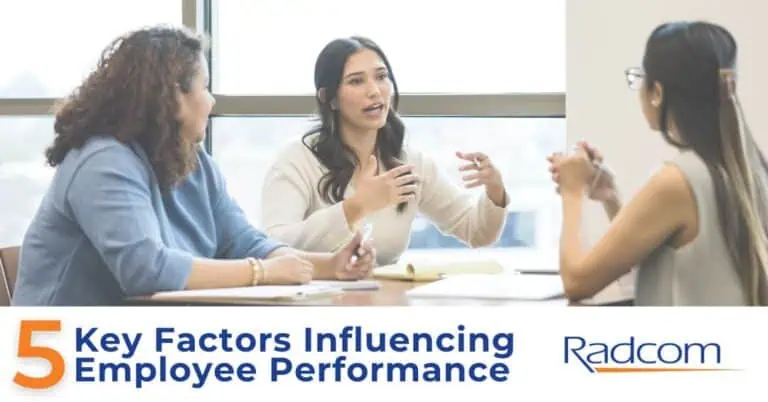 Three women sit at a table in discussion, with papers and pens in front of them. Large text below reads “5 Key Factors Influencing Employee Performance” and the Radcom logo appears in the corner.